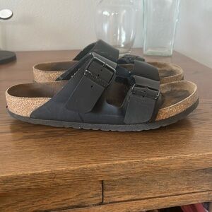 Black leather Birkenstocks.